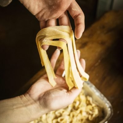 Handcrafted pasta being made with precision and care.